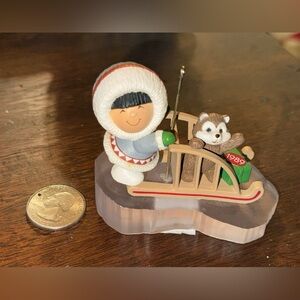 Hallmark Eskimo and Raccoon Sledding Figurine ornament